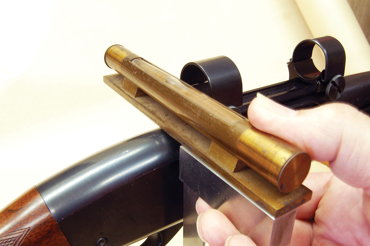 On other than bolt actions, a machinist’s square is held against flat sides to position the level. A Remington Model 760 is shown here.